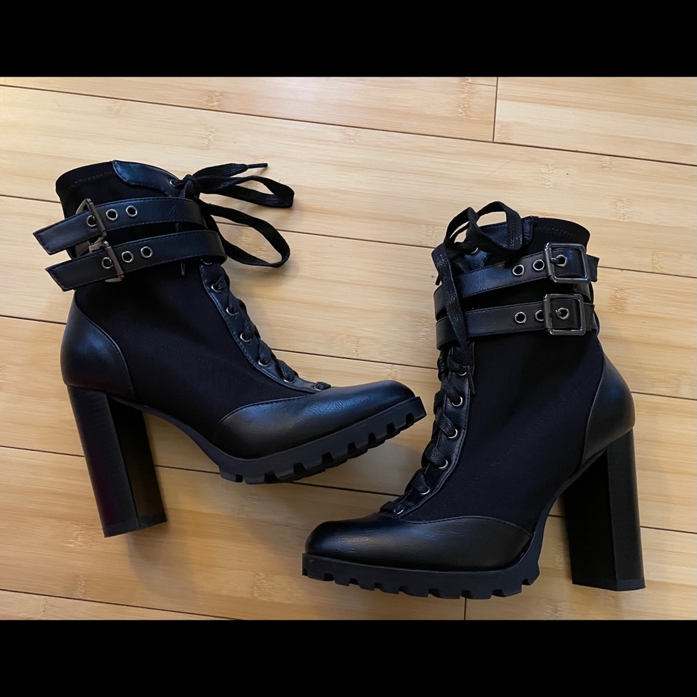 Black heels boots with buckles.